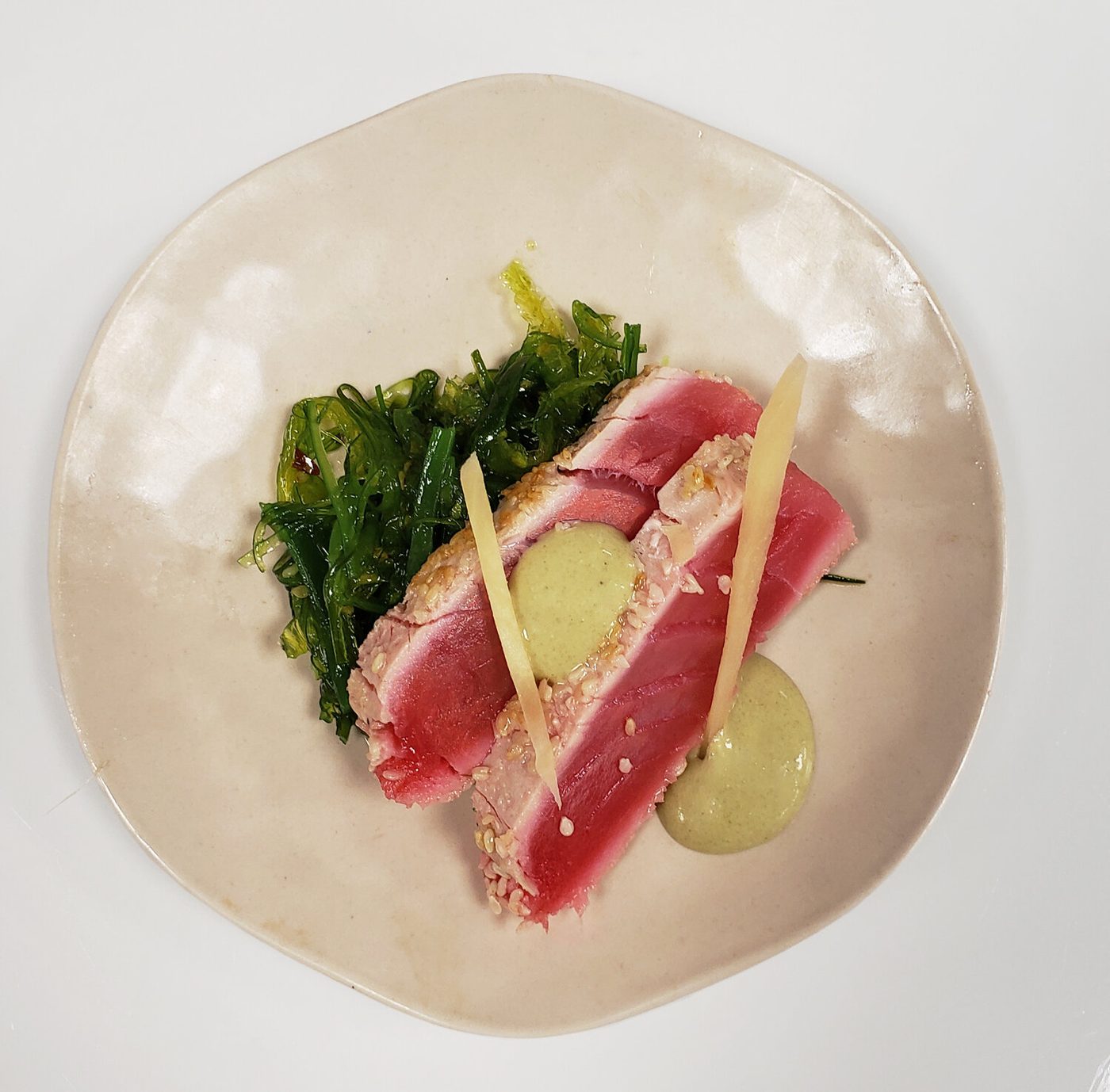 Seared tuna with seaweed salad and a green herb sauce